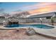 Relaxing kidney shaped pool with waterfall feature at 3167 E Battala Ct, Gilbert, AZ 85297