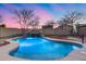 Sparkling kidney shaped pool with waterfall feature at 3167 E Battala Ct, Gilbert, AZ 85297