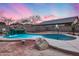 Beautiful kidney shaped pool with waterfall feature at 3167 E Battala Ct, Gilbert, AZ 85297