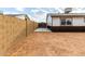 Backyard with a block wall and gate at 3214 W Grovers Ave, Phoenix, AZ 85053