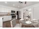 A kitchen with white cabinetry and stainless steel appliances, providing a modern and functional space at 3214 W Grovers Ave, Phoenix, AZ 85053