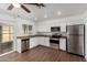 Updated kitchen featuring stainless steel appliances and wood-look flooring at 3214 W Grovers Ave, Phoenix, AZ 85053