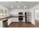 Bright kitchen with stainless steel appliances and light wood flooring at 3214 W Grovers Ave, Phoenix, AZ 85053