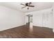 Spacious living room with wood-look tile floors, high ceilings and an open floor plan at 3214 W Grovers Ave, Phoenix, AZ 85053