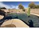 Beautiful backyard pool with mature trees and water feature at 3560 W Tina Ln, Glendale, AZ 85310