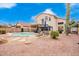 Inviting backyard with a sparkling pool, covered patio, and lush landscaping at 3664 E Juanita Ave, Gilbert, AZ 85234