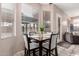 Bright breakfast nook with table and chairs, overlooking the pool at 3664 E Juanita Ave, Gilbert, AZ 85234