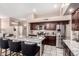 Island kitchen with granite countertops and stainless steel appliances at 3664 E Juanita Ave, Gilbert, AZ 85234