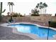 Inviting backyard features a sparkling pool, lounge area, and lush landscaping, creating a perfect retreat at 3664 E Juanita Ave, Gilbert, AZ 85234