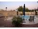 Private backyard oasis featuring a sparkling pool, lounge chairs, and lush landscaping at 3664 E Juanita Ave, Gilbert, AZ 85234