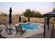 Backyard oasis with a freeform pool, lounge chairs, and a tranquil ambiance at 3664 E Juanita Ave, Gilbert, AZ 85234