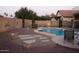 Tranquil backyard with a beautiful pool, stepping stones, lounge area, and landscaped surroundings at 3664 E Juanita Ave, Gilbert, AZ 85234