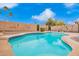 Relaxing freeform swimming pool surrounded by a spacious patio at 3664 E Juanita Ave, Gilbert, AZ 85234