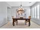 Formal dining room with chandelier and world map art at 4364 E Turnberry Ct, Gilbert, AZ 85298