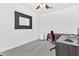 Bright home office features wood-look flooring and a large mirror at 4364 E Turnberry Ct, Gilbert, AZ 85298