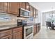 Modern kitchen with stainless steel appliances and wood cabinets at 4364 E Turnberry Ct, Gilbert, AZ 85298