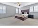 Main bedroom with a king-size bed and ceiling fan at 4364 E Turnberry Ct, Gilbert, AZ 85298