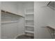 Walk-in closet with shelves and hanging rods at 4641 S Glacier St, Mesa, AZ 85212