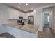 Modern kitchen with white cabinets and a large island at 4641 S Glacier St, Mesa, AZ 85212