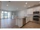 Modern kitchen with stainless steel appliances and island at 4641 S Glacier St, Mesa, AZ 85212