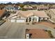 Single story house with a three car garage and mountain views at 4644 W Soft Wind Dr, Glendale, AZ 85310