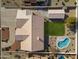 Overhead view of house, pool, and grassy backyard at 4644 W Soft Wind Dr, Glendale, AZ 85310