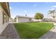 Large backyard with grassy area and shed at 4644 W Soft Wind Dr, Glendale, AZ 85310