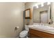 Guest bathroom with a single vanity and toilet at 4644 W Soft Wind Dr, Glendale, AZ 85310