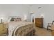 Charming bedroom with antique dresser and metal bed frame at 4644 W Soft Wind Dr, Glendale, AZ 85310