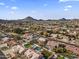 Neighborhood overview showing various homes and landscape at 4644 W Soft Wind Dr, Glendale, AZ 85310