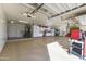 Organized garage with cabinets and workbenches at 4644 W Soft Wind Dr, Glendale, AZ 85310