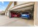 Garage with three vehicles and extra storage space at 4644 W Soft Wind Dr, Glendale, AZ 85310