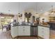 Kitchen island with granite countertop and stainless steel dishwasher at 4644 W Soft Wind Dr, Glendale, AZ 85310