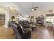 Spacious living room featuring a fireplace and hardwood floors at 4644 W Soft Wind Dr, Glendale, AZ 85310