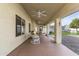 Covered patio with rocking chairs and backyard access at 4644 W Soft Wind Dr, Glendale, AZ 85310