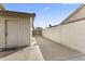 Side yard with storage shed and gate at 4644 W Soft Wind Dr, Glendale, AZ 85310