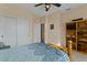 Bedroom with double closet and built-in shelving at 517 N Cambridge St, Gilbert, AZ 85233