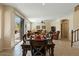 Dining area with sliding door access to the backyard and views of the living area at 517 N Cambridge St, Gilbert, AZ 85233