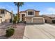 Two-story house with three-car garage and desert landscaping at 517 N Cambridge St, Gilbert, AZ 85233