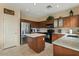 Kitchen features stainless steel appliances, granite countertops, and ample cabinet space at 517 N Cambridge St, Gilbert, AZ 85233