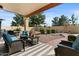 Relaxing patio with seating area and view of backyard at 517 N Cambridge St, Gilbert, AZ 85233