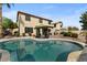 Relaxing kidney shaped pool with large patio and house view at 517 N Cambridge St, Gilbert, AZ 85233