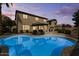 Inviting backyard pool with lounge chairs and patio umbrella at 517 N Cambridge St, Gilbert, AZ 85233