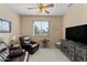 Relaxing sitting area featuring two leather recliners and a large TV at 517 N Cambridge St, Gilbert, AZ 85233