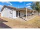 Backyard patio with covered pergola structure at 5321 W Country Gables Dr, Glendale, AZ 85306