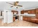 Updated kitchen featuring wood cabinets and granite countertops at 5321 W Country Gables Dr, Glendale, AZ 85306