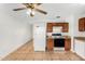 Kitchen with wood cabinets, granite counters and tile floors at 5321 W Country Gables Dr, Glendale, AZ 85306