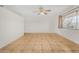 Living room with tile floor, ceiling fan and window at 5321 W Country Gables Dr, Glendale, AZ 85306