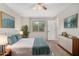 Bright bedroom with king bed, teal accents, and two nightstands at 5343 S El Camino Dr, Tempe, AZ 85283