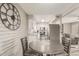 Dining area with a round table and chairs, open to kitchen at 5518 E Lindstrom Ln # A12, Mesa, AZ 85215